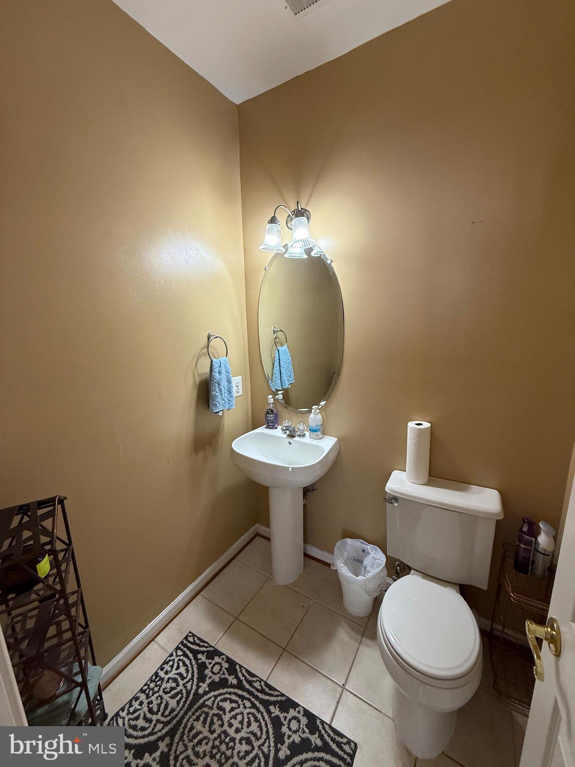 4617 Hummingbird Lane, Unit 110 Fairfax, VA 22033 - Photo 21 of 45 a bathroom with a toilet a sink and mirror
