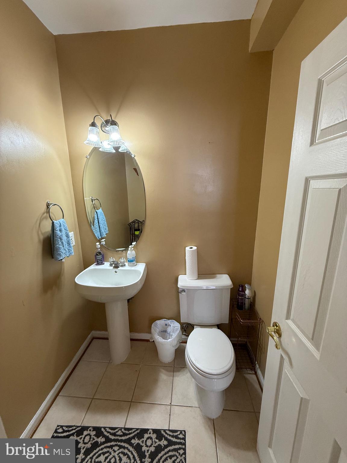 4617 Hummingbird Lane, Unit 110 Fairfax, VA 22033 - Photo 22 of 45 a bathroom with a toilet sink and mirror