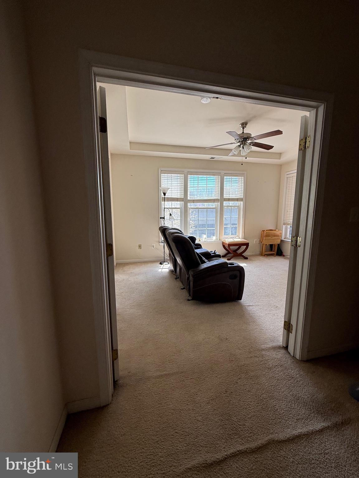 4617 Hummingbird Lane, Unit 110 Fairfax, VA 22033 - Photo 23 of 45 a living room with furniture a window and a flat screen tv