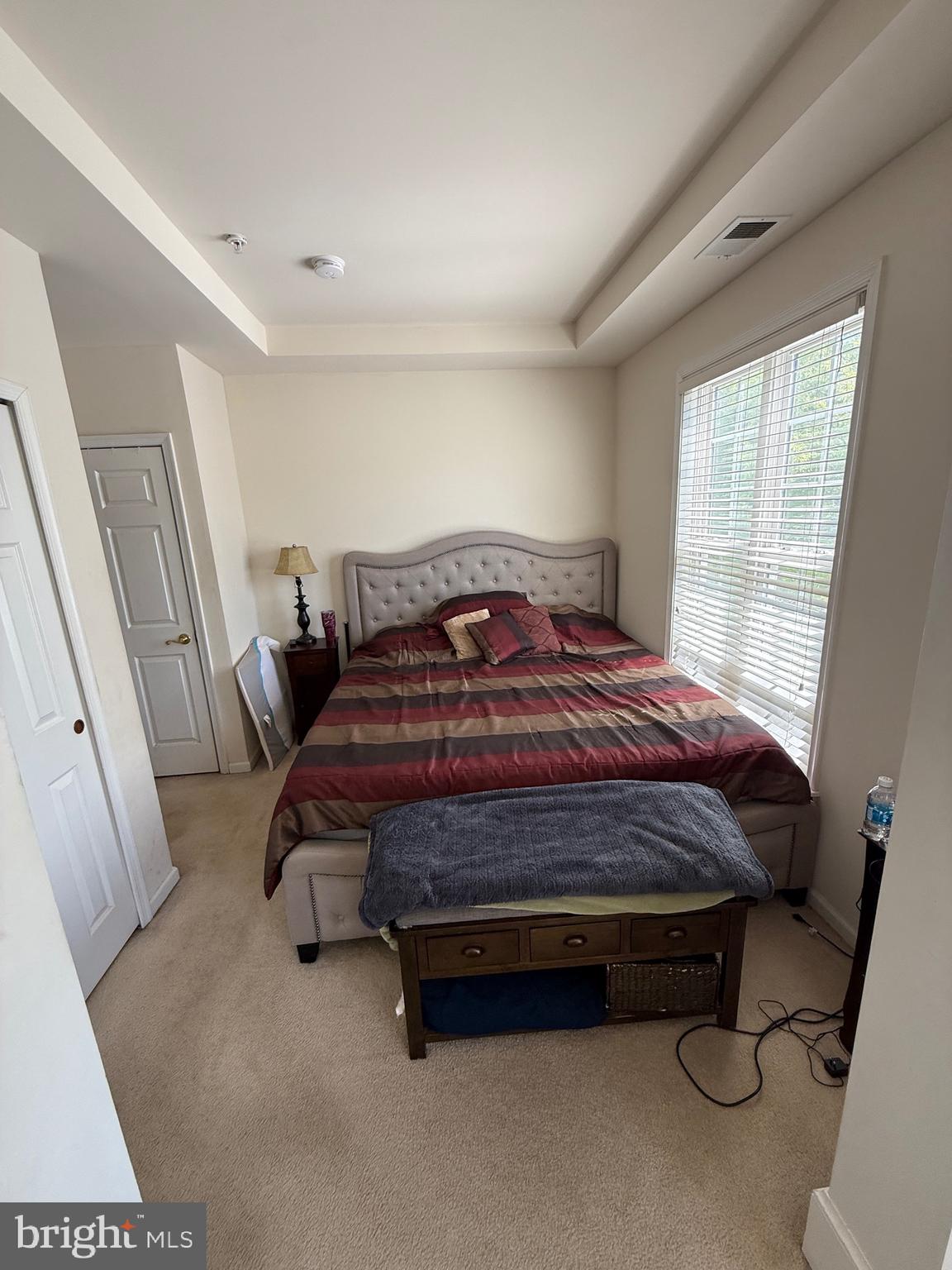 4617 Hummingbird Lane, Unit 110 Fairfax, VA 22033 - Photo 25 of 45 a bedroom with a bed and window