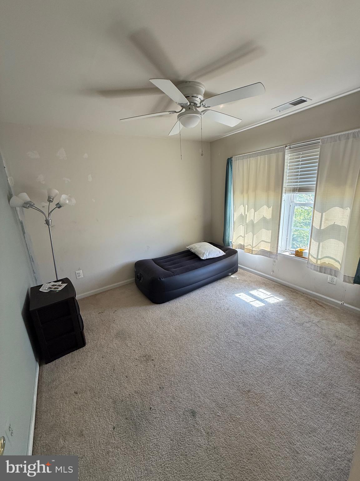 4617 Hummingbird Lane, Unit 110 Fairfax, VA 22033 - Photo 34 of 45 a living room with furniture and a large window