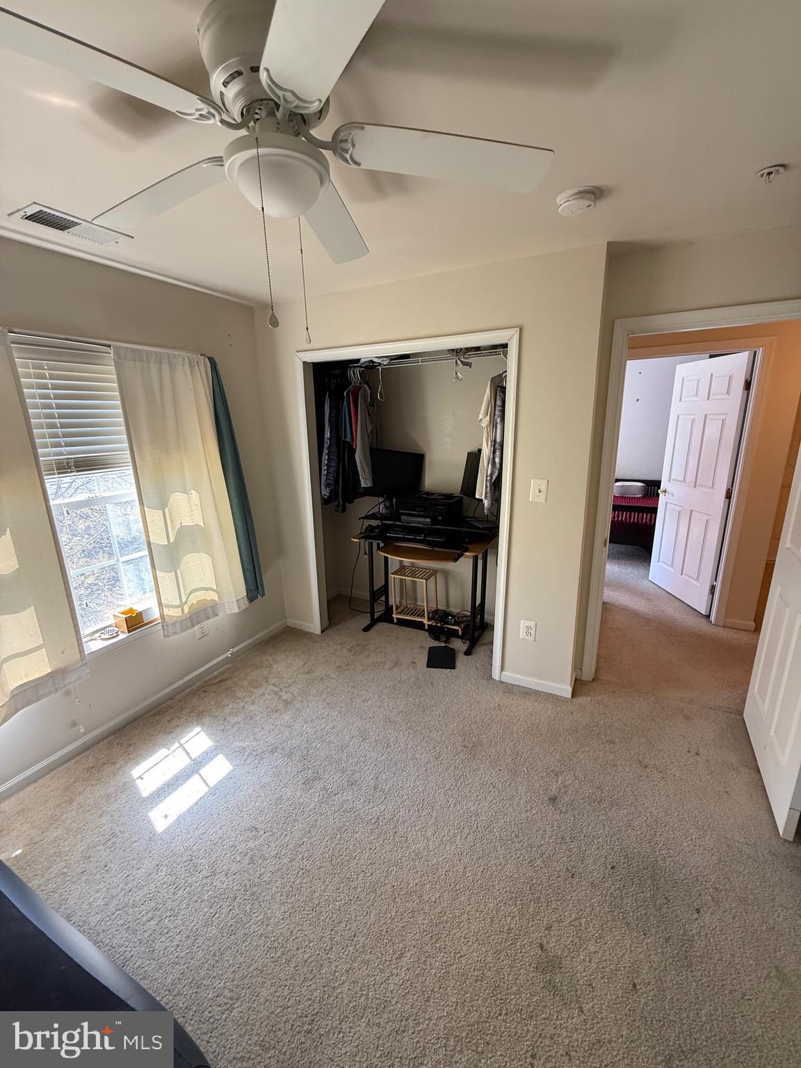 4617 Hummingbird Lane, Unit 110 Fairfax, VA 22033 - Photo 35 of 45 a view of a livingroom with furniture and a ceiling fan