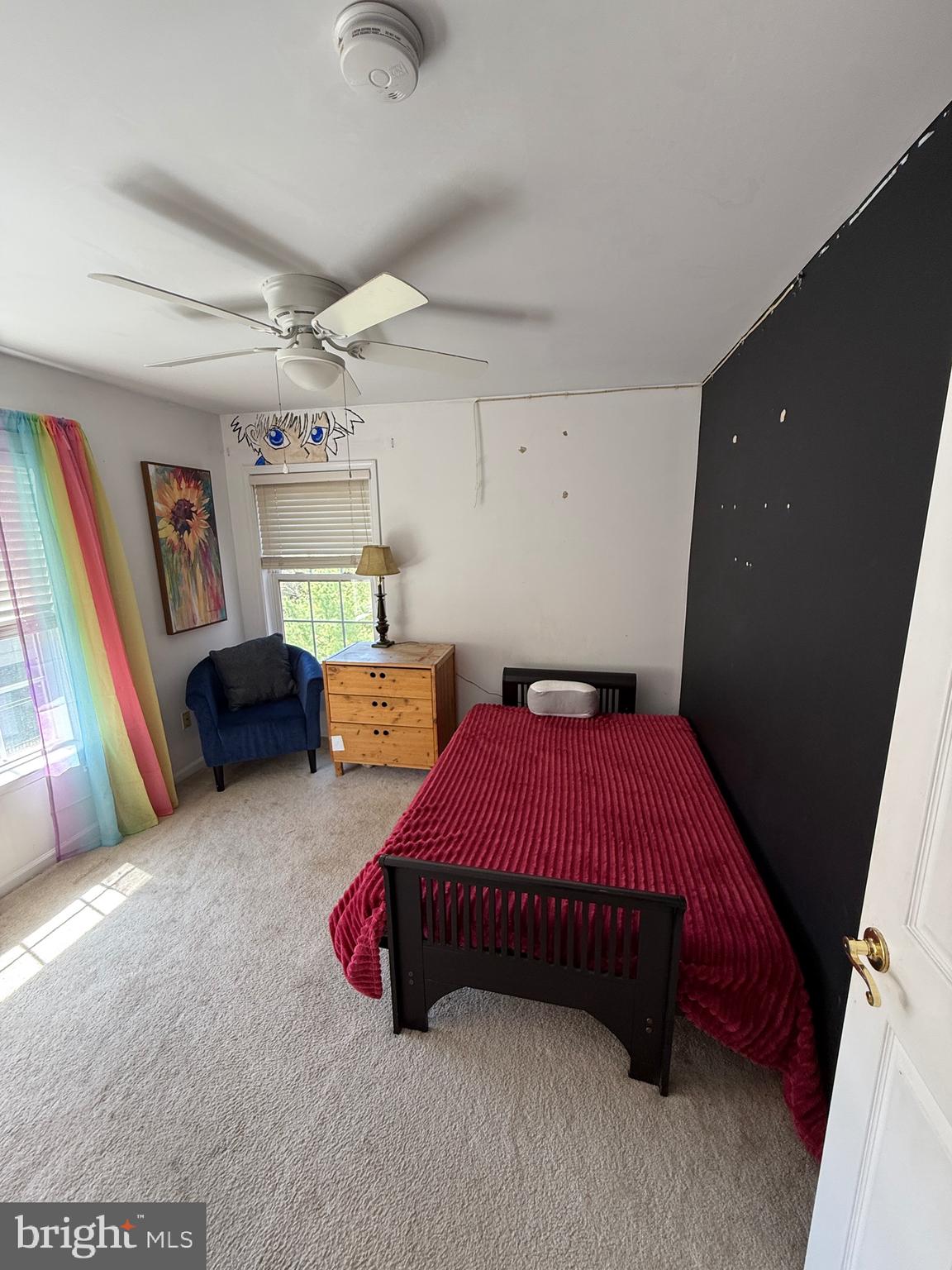 4617 Hummingbird Lane, Unit 110 Fairfax, VA 22033 - Photo 36 of 45 a bedroom with a bed and a chandelier