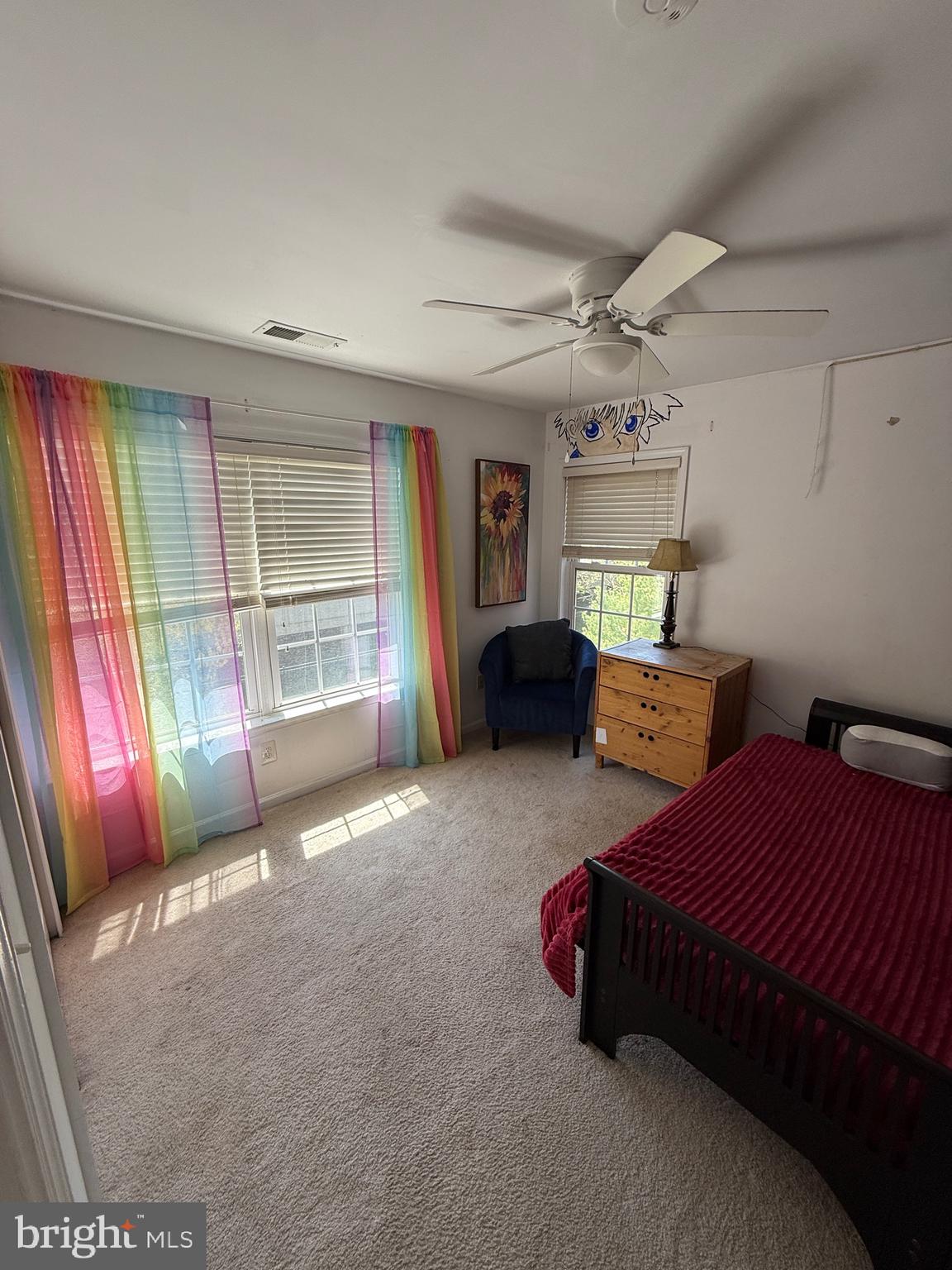 4617 Hummingbird Lane, Unit 110 Fairfax, VA 22033 - Photo 37 of 45 a spacious bedroom with a bed and a chandelier