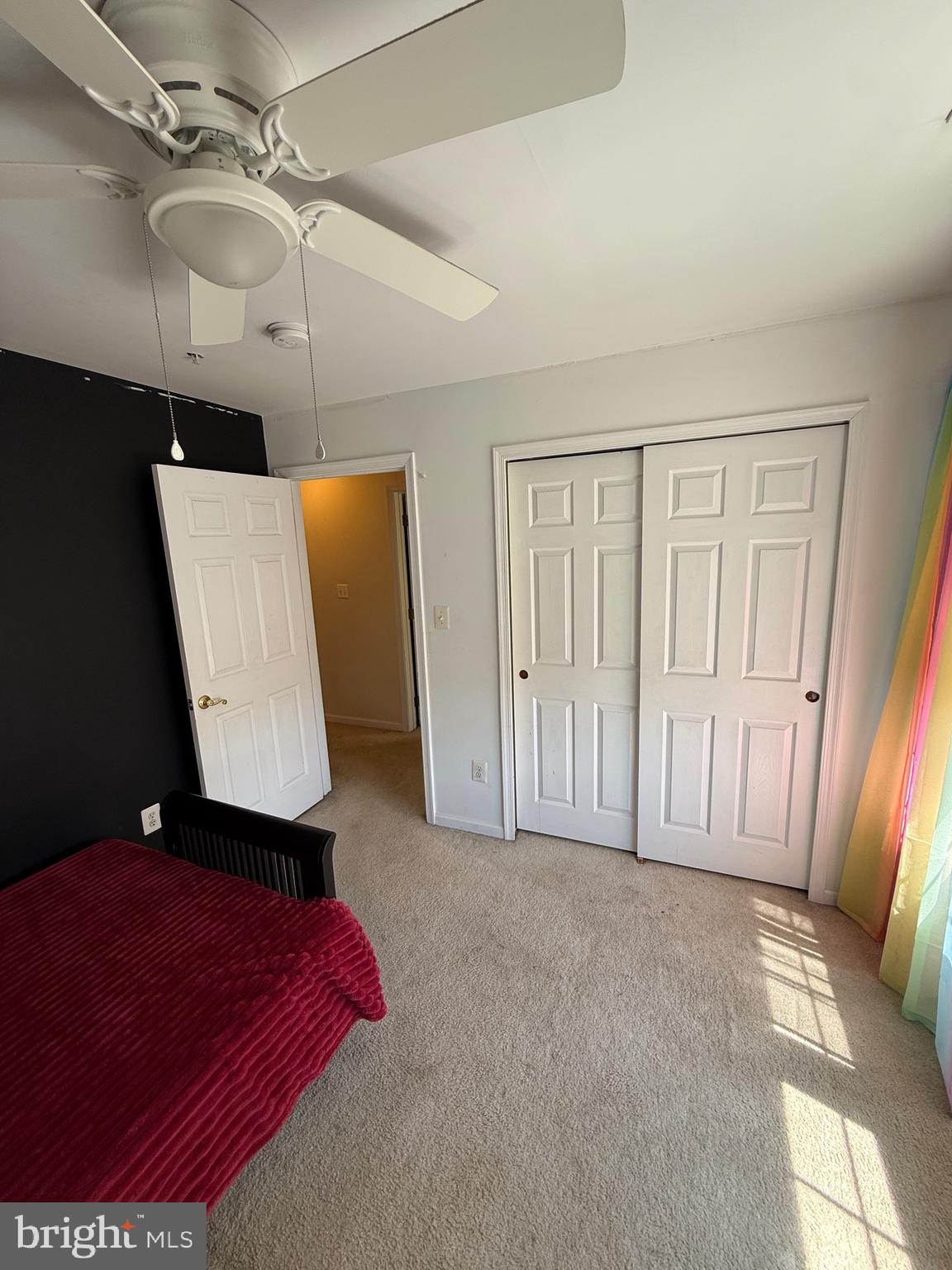 4617 Hummingbird Lane, Unit 110 Fairfax, VA 22033 - Photo 38 of 45 a living room with a couch and a chandelier