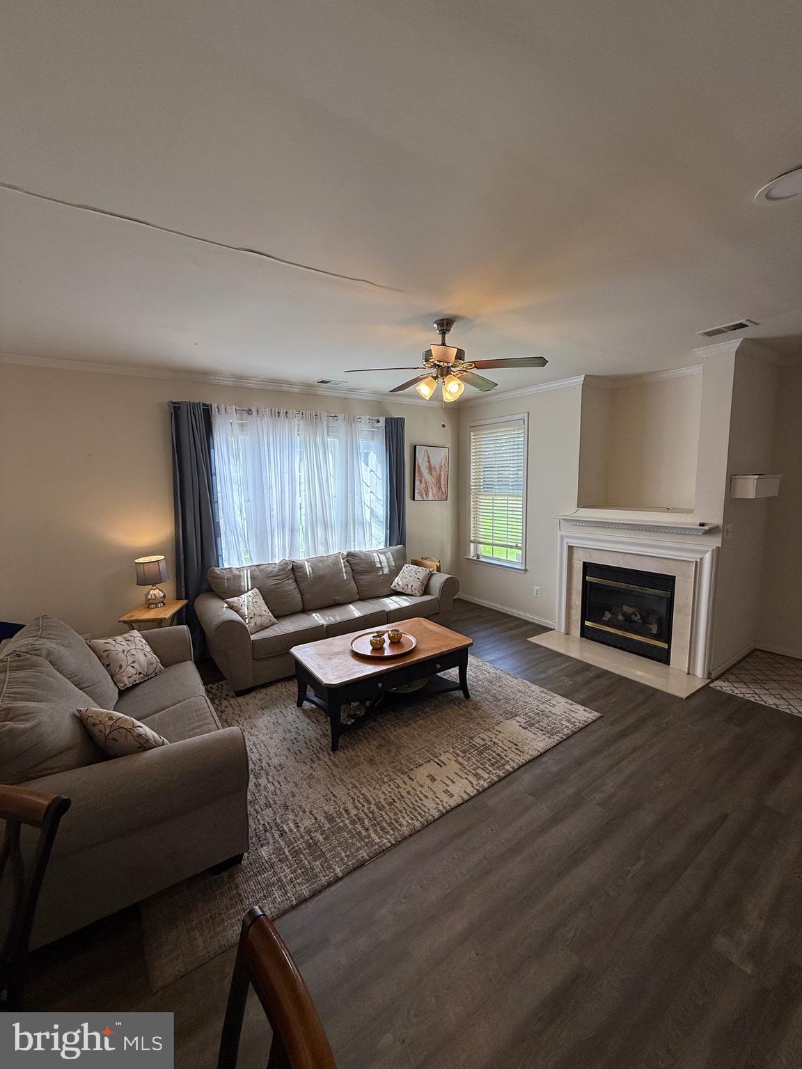 4617 Hummingbird Lane, Unit 110 Fairfax, VA 22033 - Photo 10 of 45 a living room with furniture and a fireplace