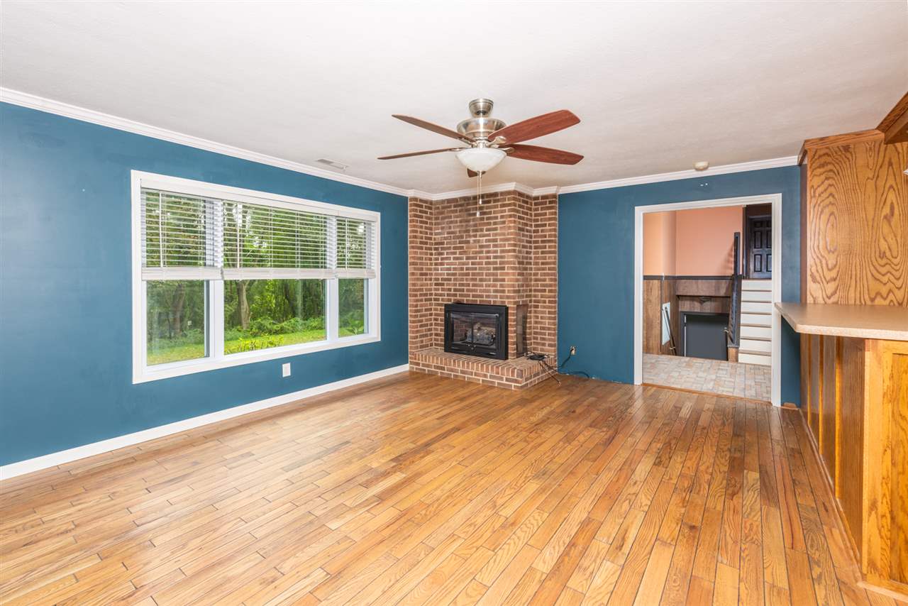 1959 Shutterlee Mill Road Staunton, VA 24401 - Photo 20 of 50 a view of empty room with wooden floor and fan