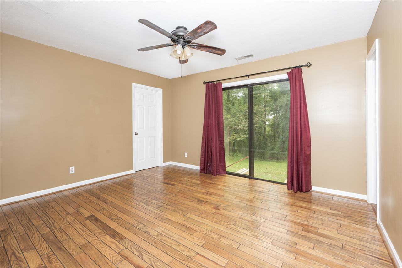 1959 Shutterlee Mill Road Staunton, VA 24401 - Photo 2 of 50 wooden floor in an empty room with a window