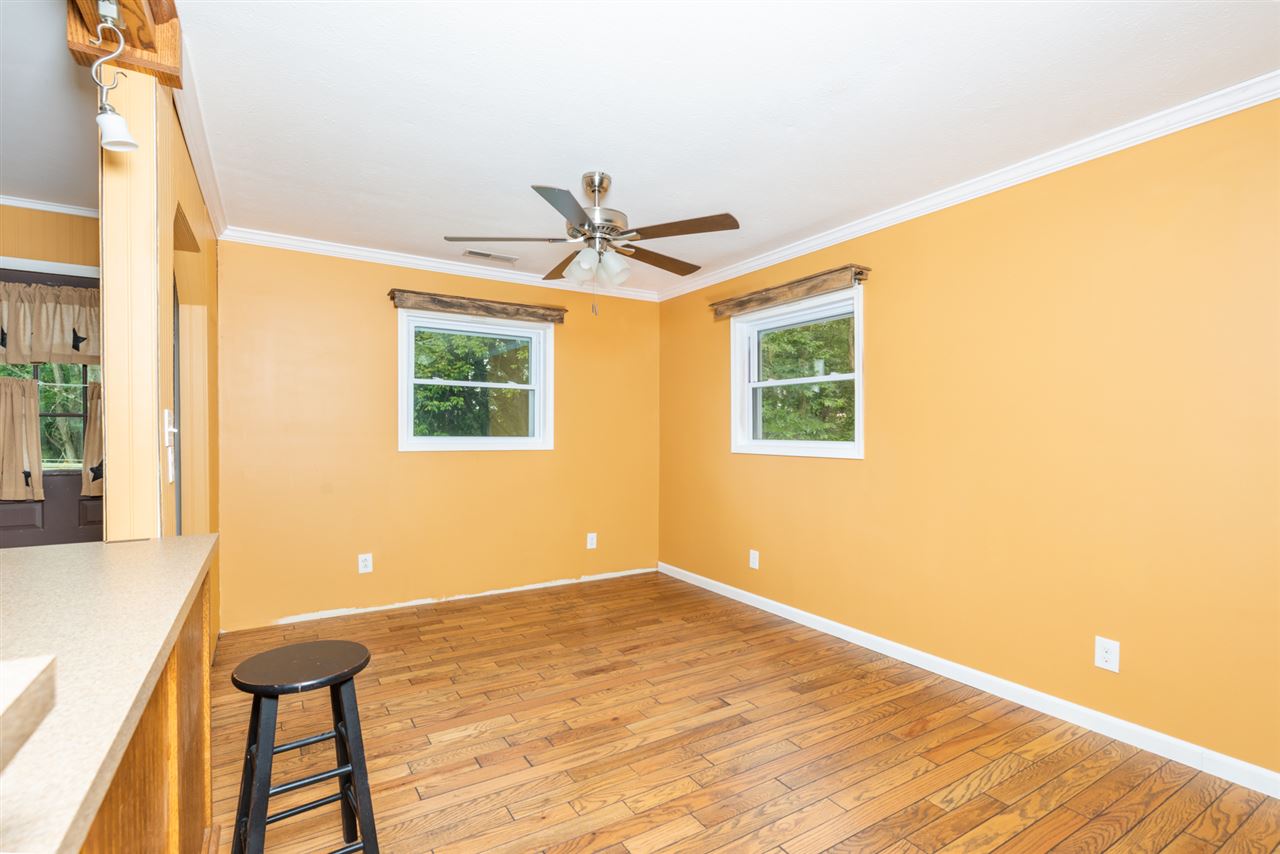 1959 Shutterlee Mill Road Staunton, VA 24401 - Photo 22 of 50 a view of a livingroom with a ceiling fan and window