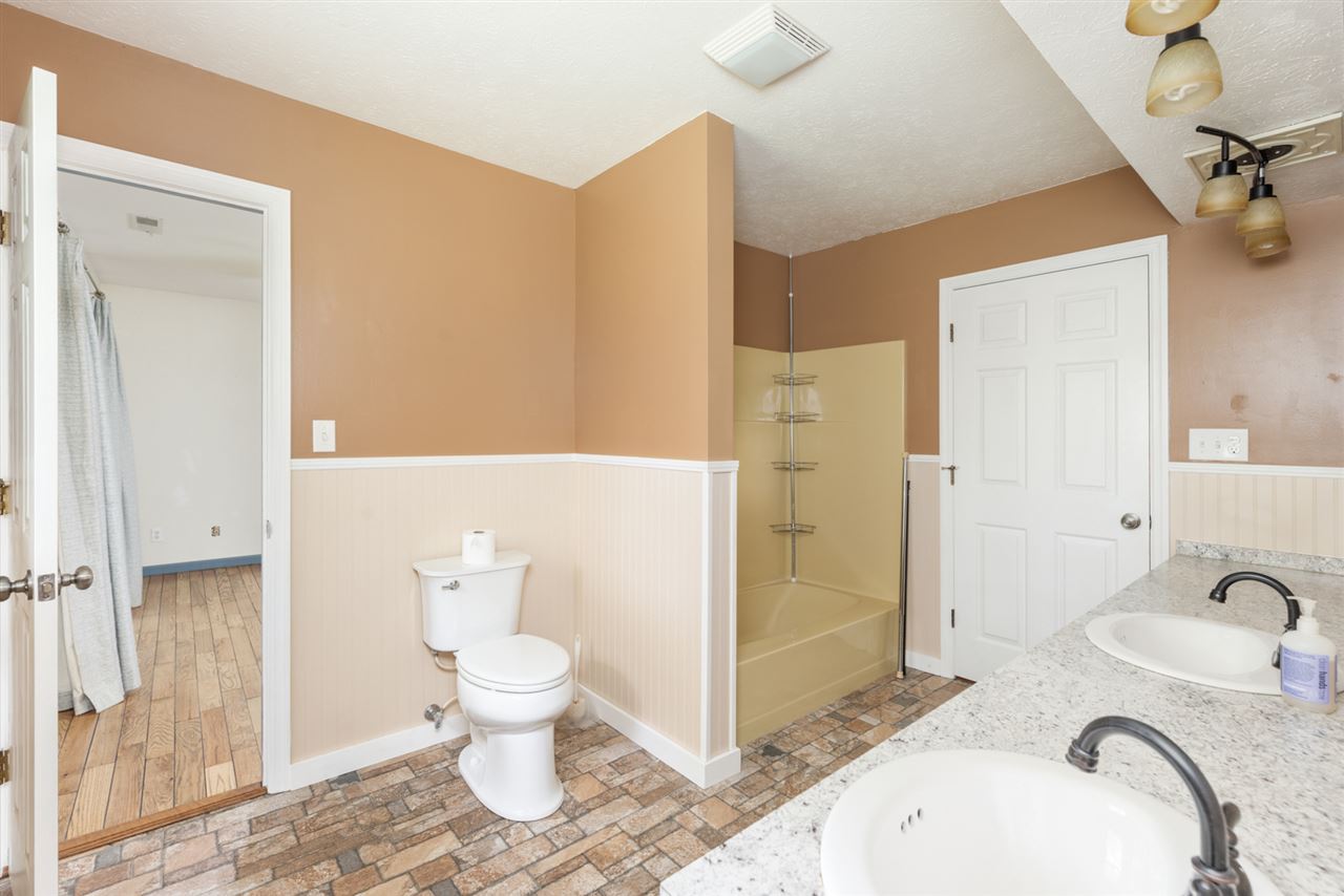 1959 Shutterlee Mill Road Staunton, VA 24401 - Photo 4 of 50 a bathroom with a granite countertop sink toilet and shower
