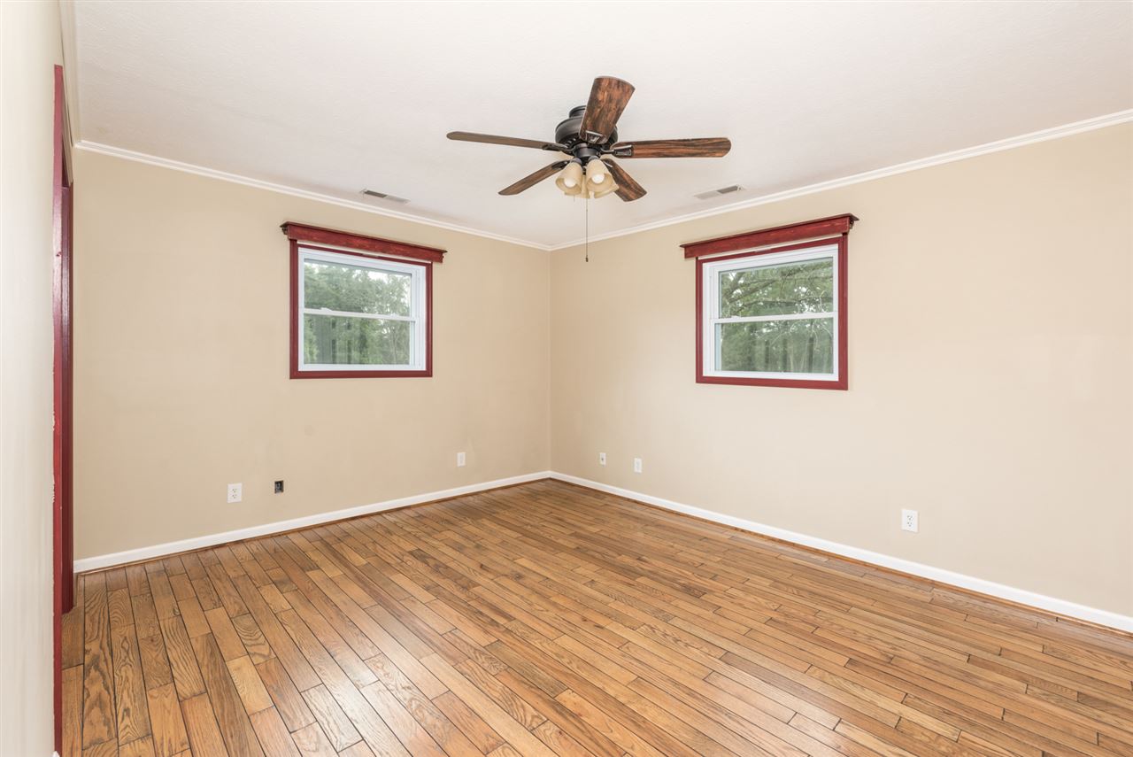 1959 Shutterlee Mill Road Staunton, VA 24401 - Photo 8 of 50 a view of empty room with wooden floor and fan