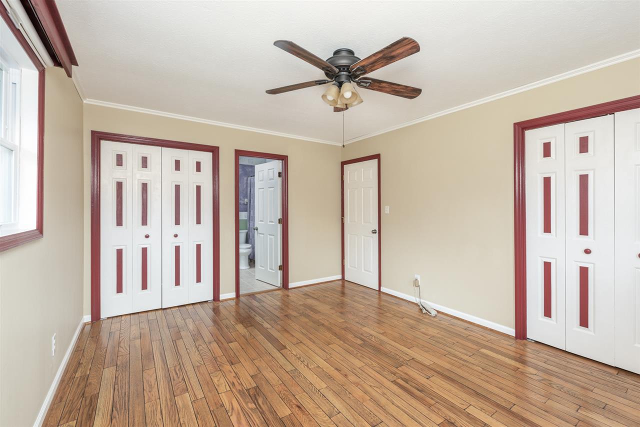 1959 Shutterlee Mill Road Staunton, VA 24401 - Photo 9 of 50 an empty room with wooden floor and windows