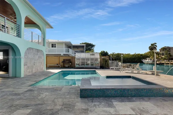 a bedroom with a bed and ceiling fan