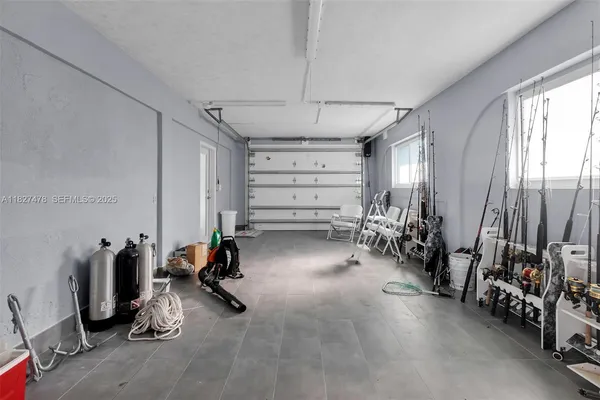a kitchen with stainless steel appliances granite countertop counter top space and a view of living room