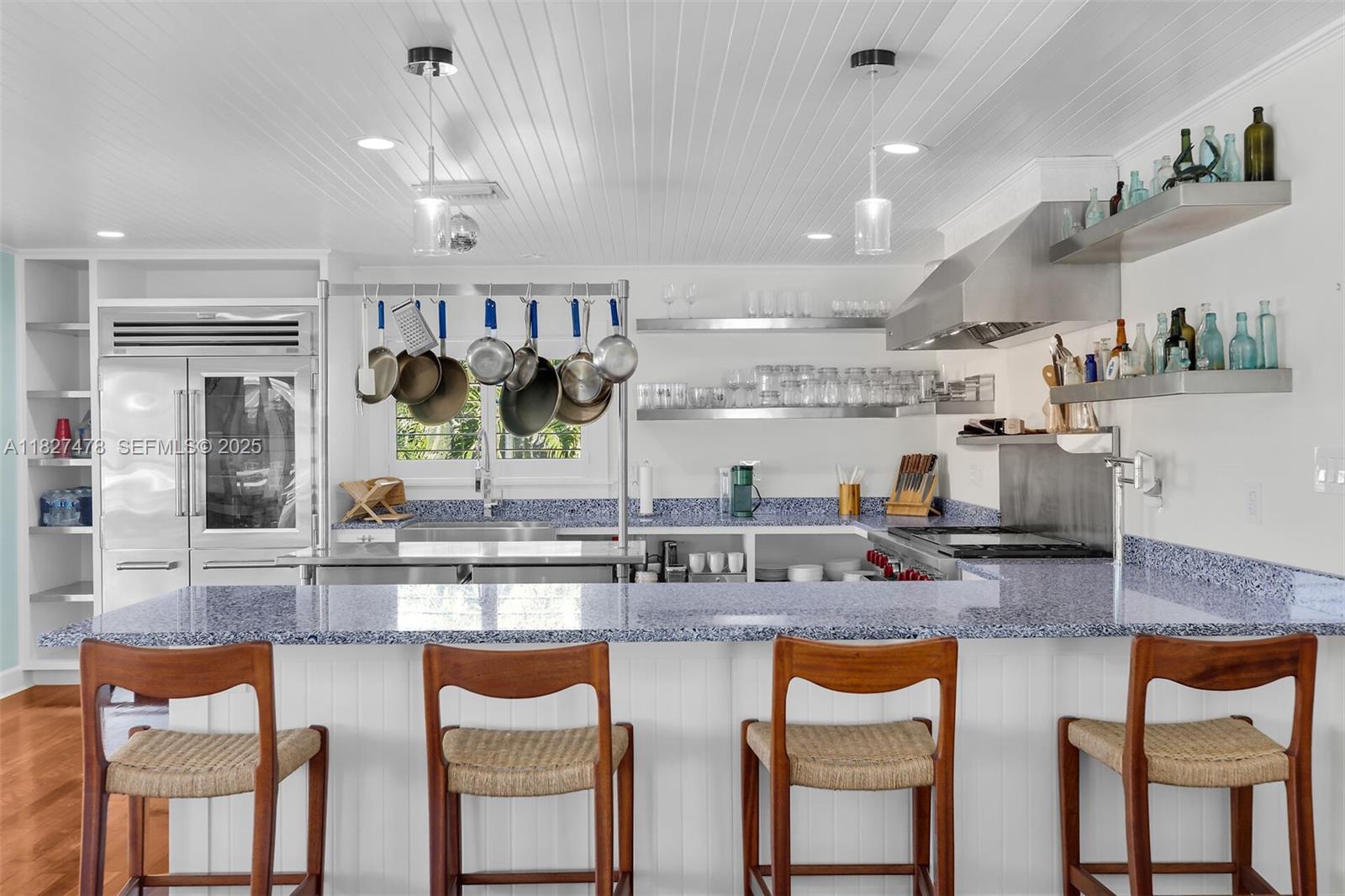 232 West Seaview Drive Marathon, FL 33050 - Photo 31 of 72 a kitchen with stainless steel appliances granite countertop counter top space and a view of living room
