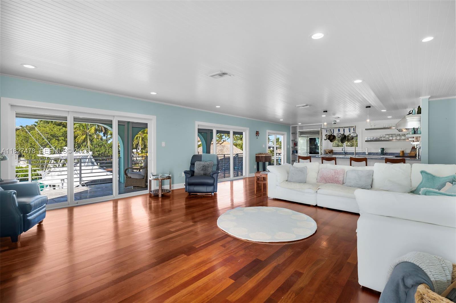 232 West Seaview Drive Marathon, FL 33050 - Photo 35 of 72 a living room with furniture and a wooden floor