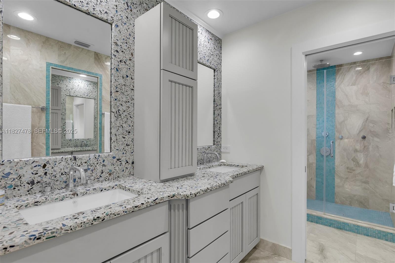 232 West Seaview Drive Marathon, FL 33050 - Photo 41 of 72 a bathroom with a granite countertop sink and a mirror