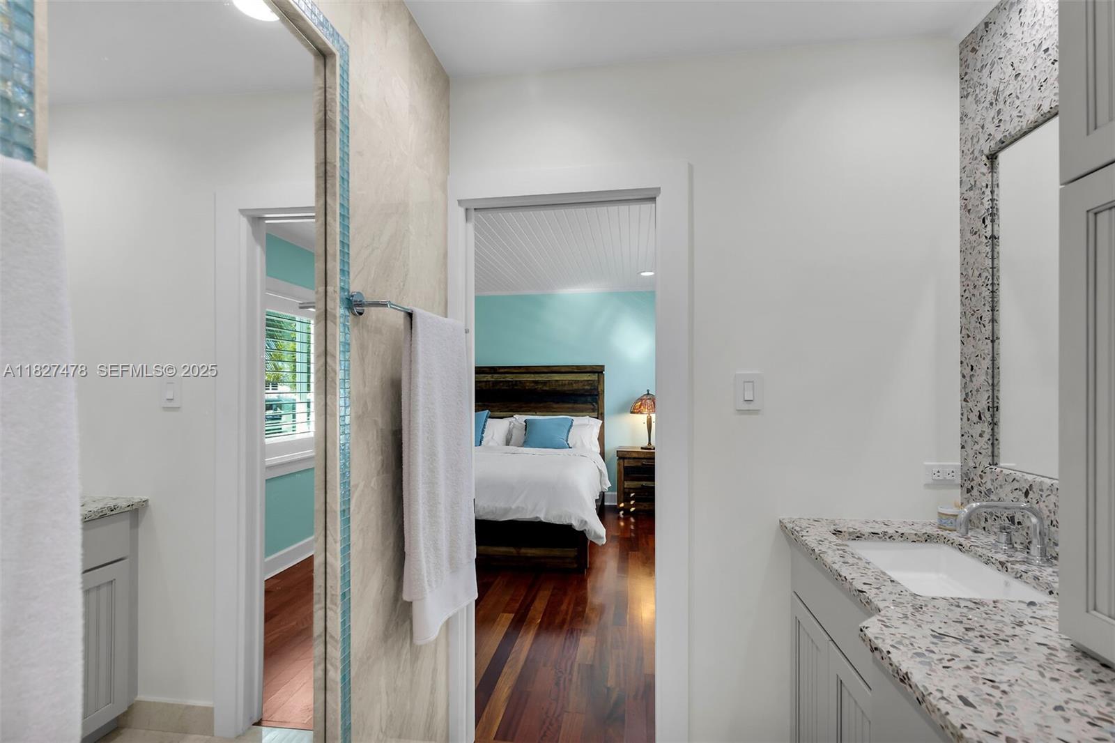 232 West Seaview Drive Marathon, FL 33050 - Photo 43 of 72 a en suite bathroom with a granite countertop sink and a mirror