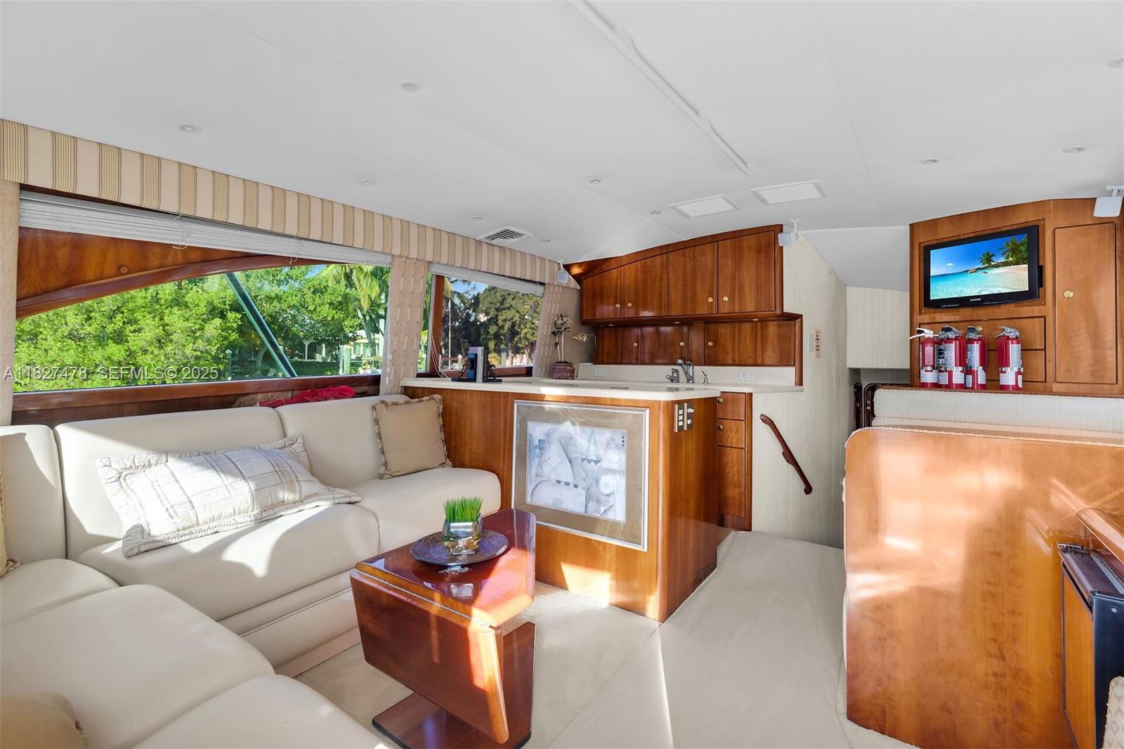 232 West Seaview Drive Marathon, FL 33050 - Photo 63 of 72 a living room with furniture a fireplace and a flat screen tv