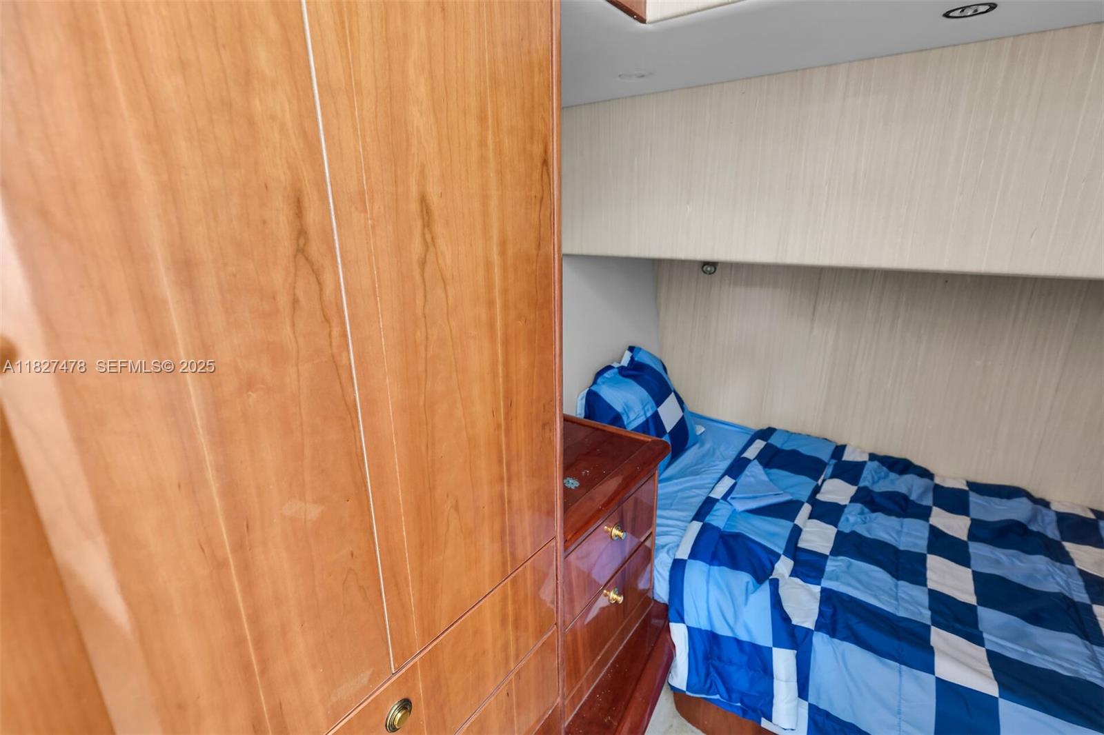 232 West Seaview Drive Marathon, FL 33050 - Photo 70 of 72 a bed sitting in a bedroom next to a curtain and a curtain