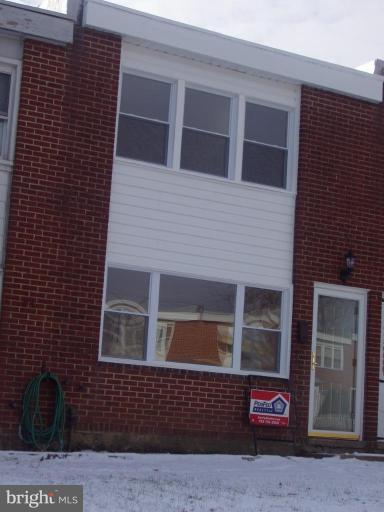 2777 Yarnall Road Halethorpe, MD 21227 - Photo 1 of 23 a view of a brick house with large windows
