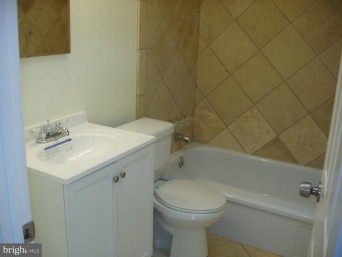 2777 Yarnall Road Halethorpe, MD 21227 - Photo 12 of 23 a bathroom with a sink a toilet and shower
