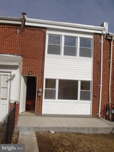 2777 Yarnall Road Halethorpe, MD 21227 - Photo 4 of 23 a front view of a house with a garage