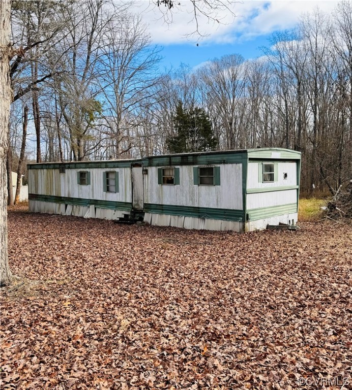738 Roundabout Road Louisa, VA 23093 - Photo 2 of 9 front view of a house with a yard