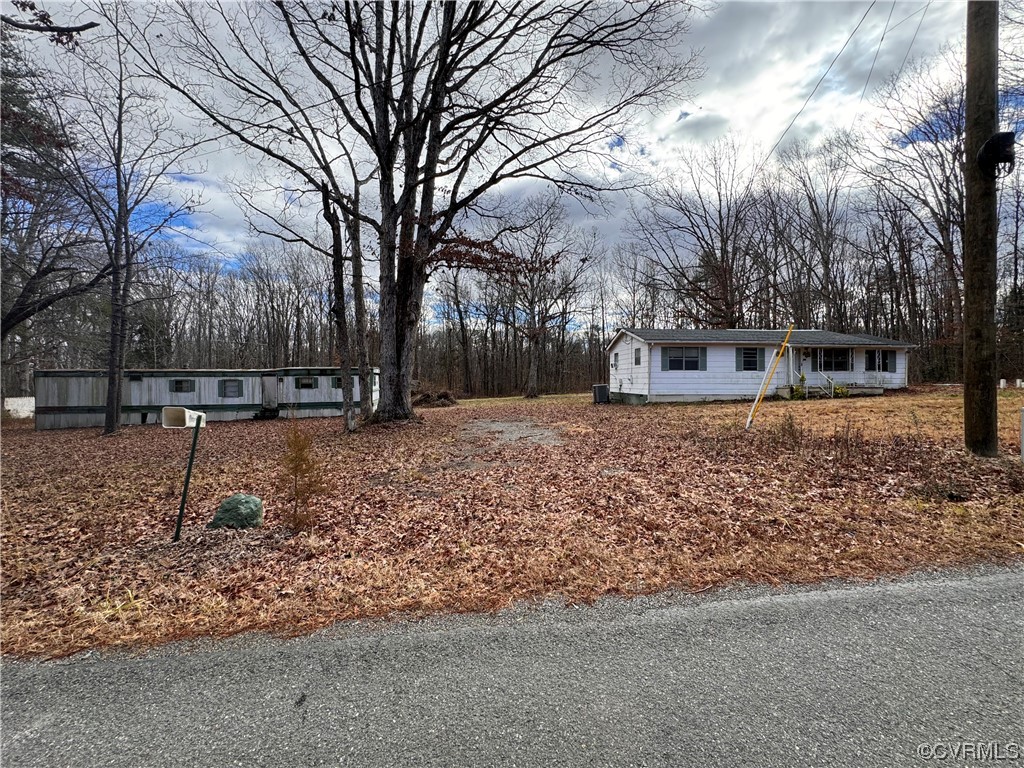 738 Roundabout Road Louisa, VA 23093 - Photo 3 of 9 a backyard of a house with lots of green space