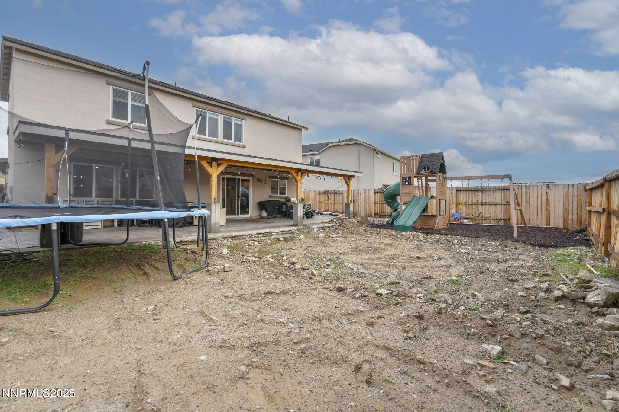 8961 Buffalo Grove Drive Reno, NV 89506 - Photo 21 of 23 a backyard of a house with table and chairs