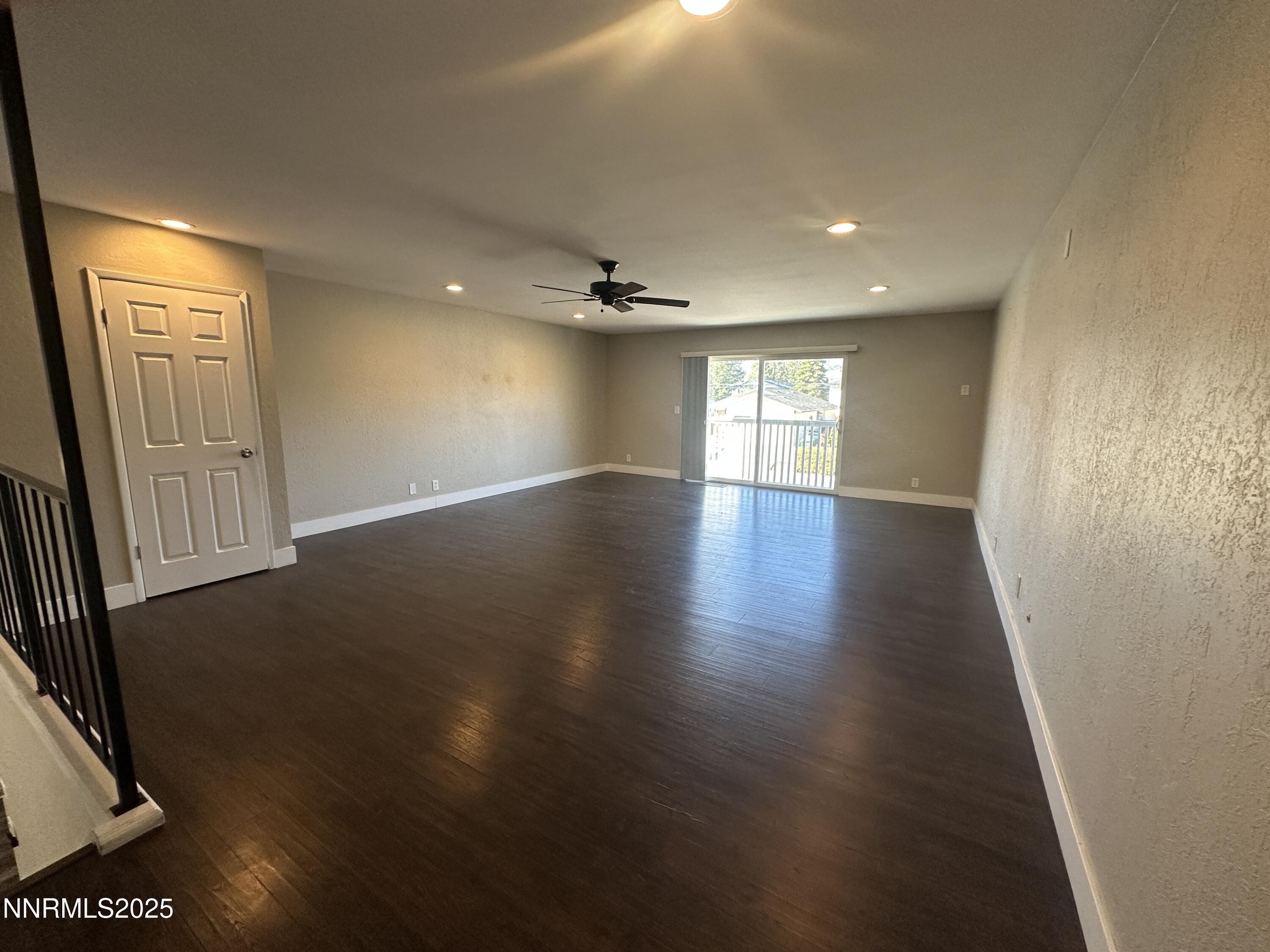 3511 Imperial Way Carson City, NV 89706 - Photo 15 of 15 an empty room with wooden floor and windows