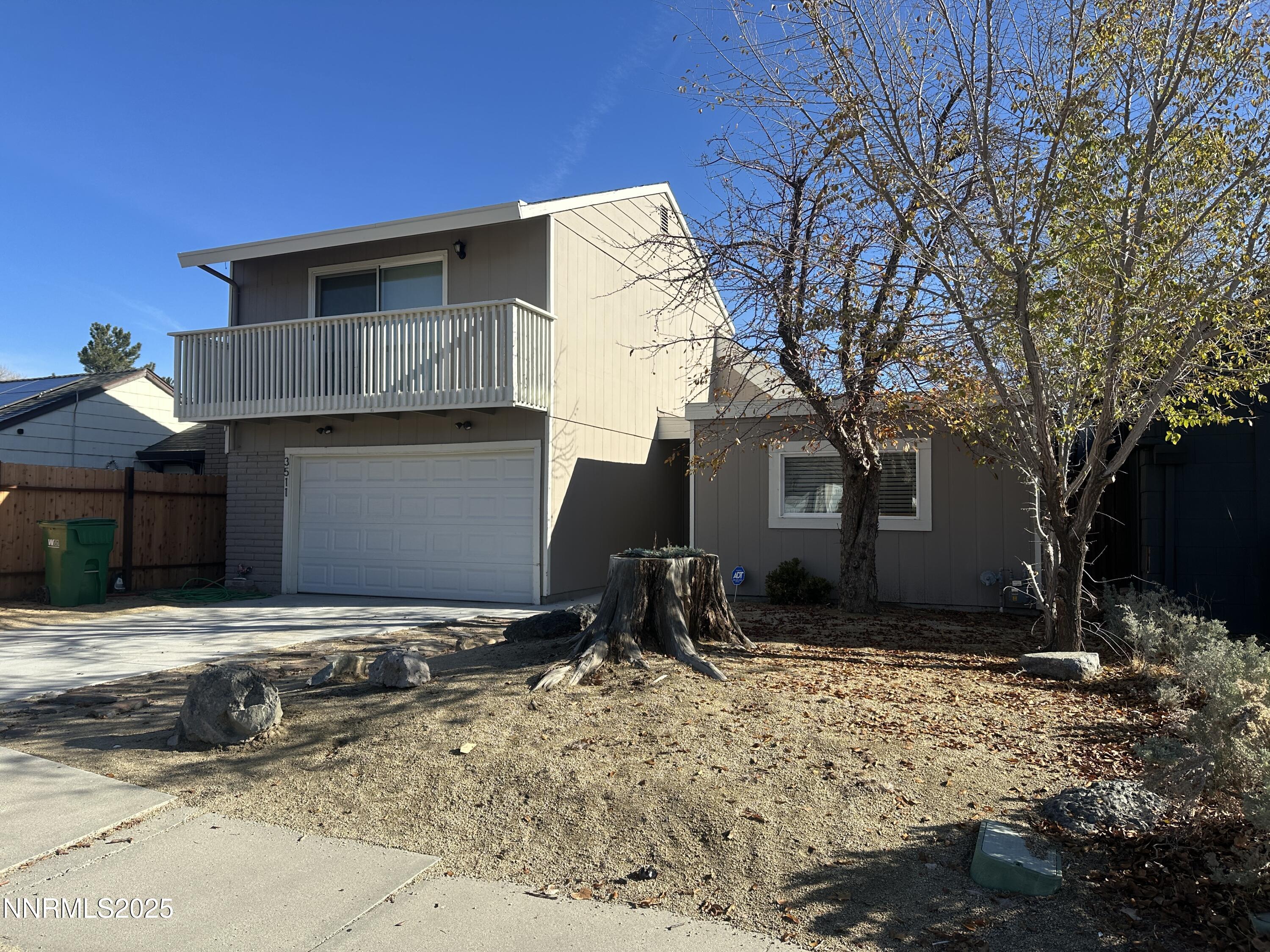 3511 Imperial Way Carson City, NV 89706 - Photo 2 of 15 a front view of a house with a yard