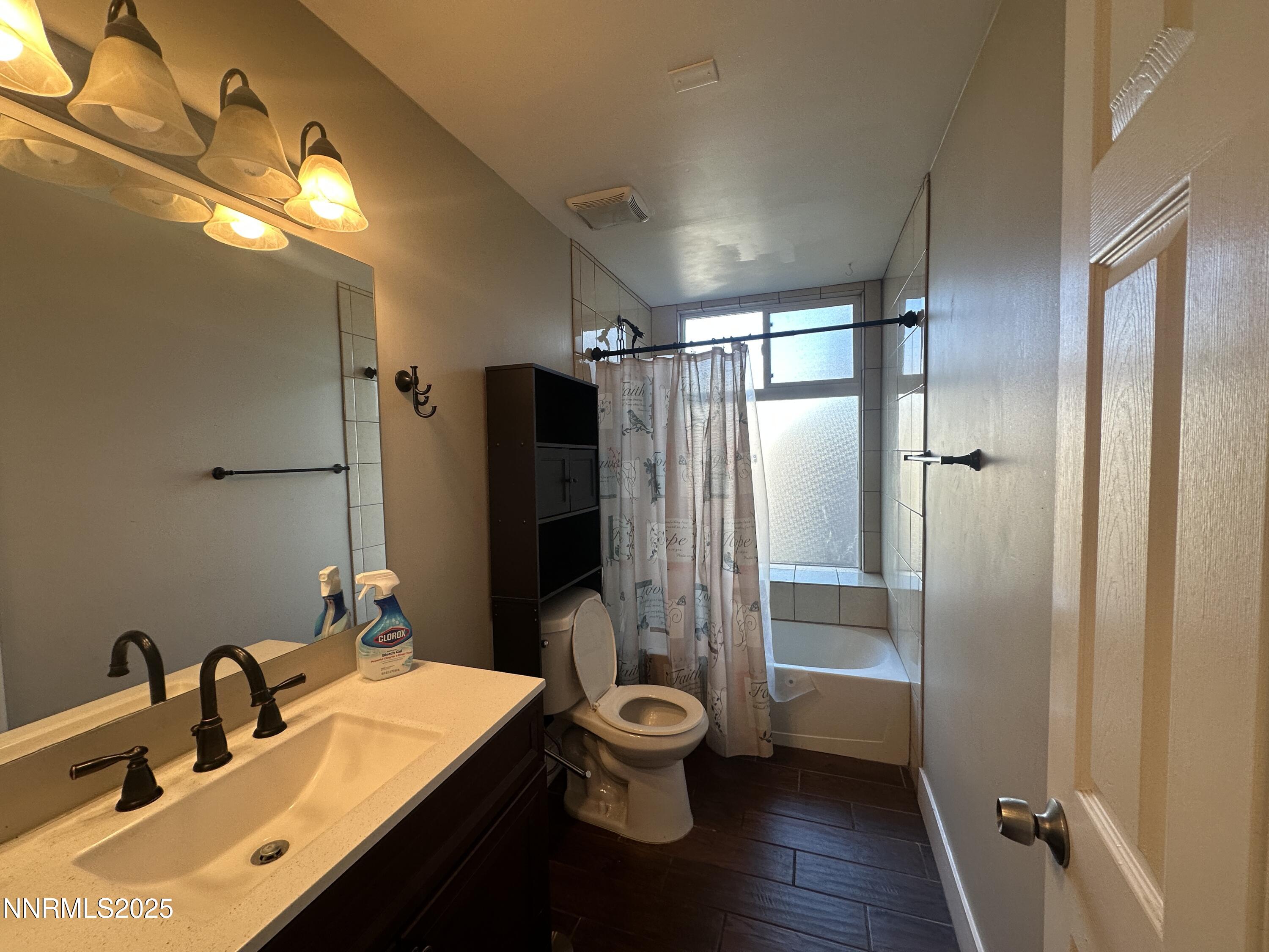 3511 Imperial Way Carson City, NV 89706 - Photo 5 of 15 a bathroom with a double vanity sink toilet mirror and shower