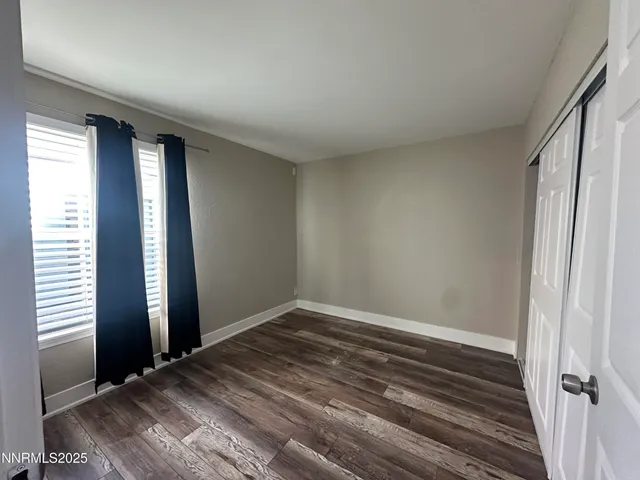 wooden floor and window in an empty room