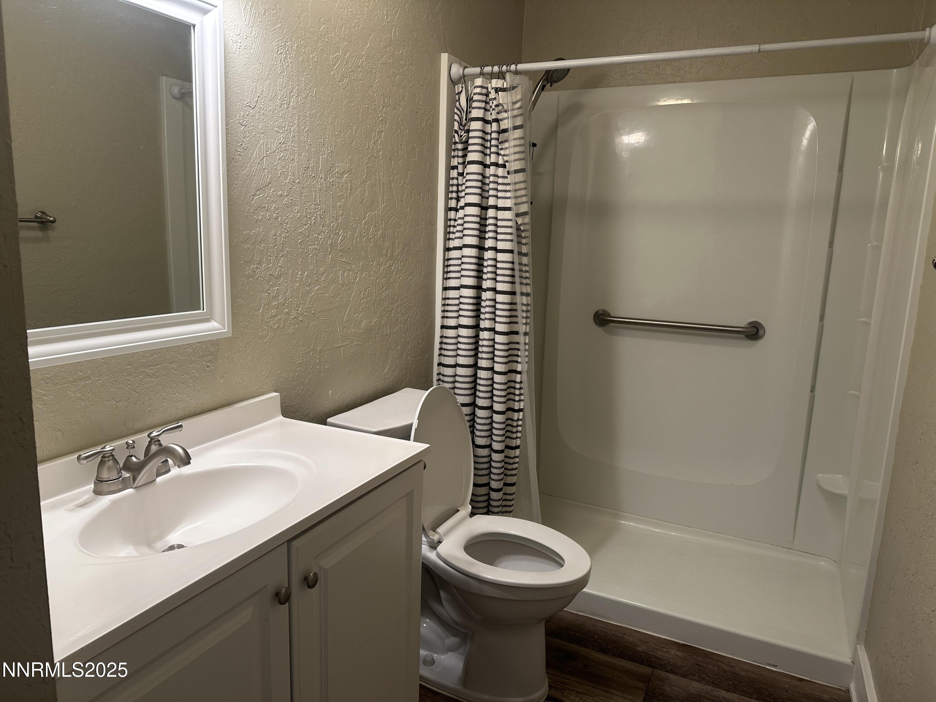 3511 Imperial Way Carson City, NV 89706 - Photo 7 of 15 a bathroom with a sink toilet and shower