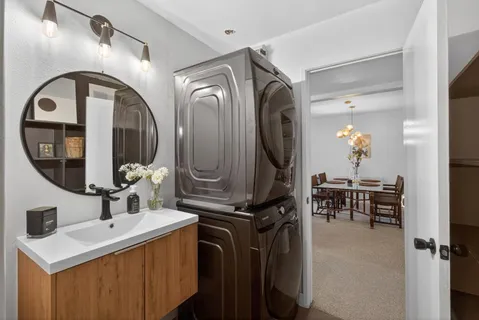a bathroom with a double vanity sink and a mirror
