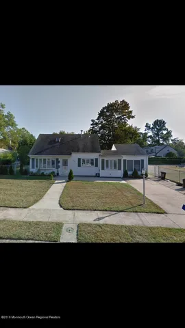 a view of swimming pool with a yard and seating area