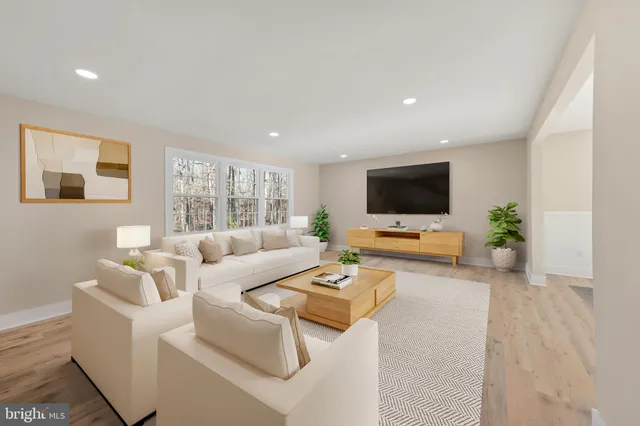 a kitchen with white cabinets and window