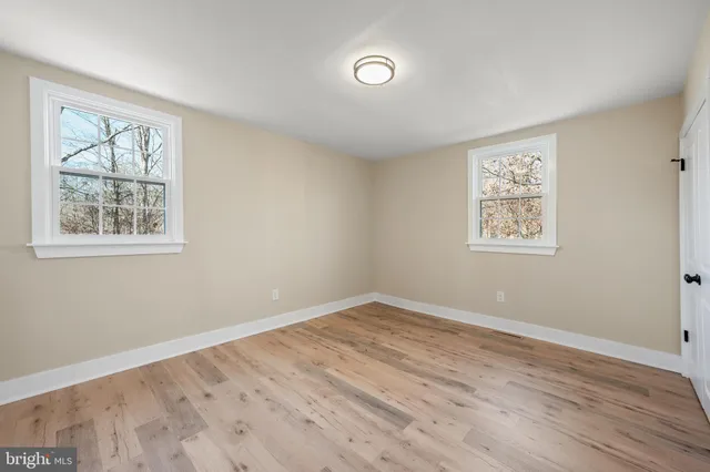 a view of a livingroom with furniture and hardwood floor