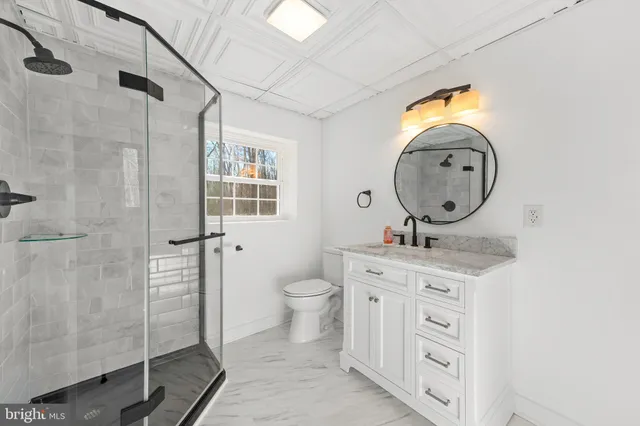 a view of a workspace with furniture and a workspace