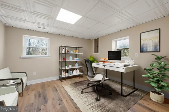 a backyard of a house with barbeque oven table and chairs