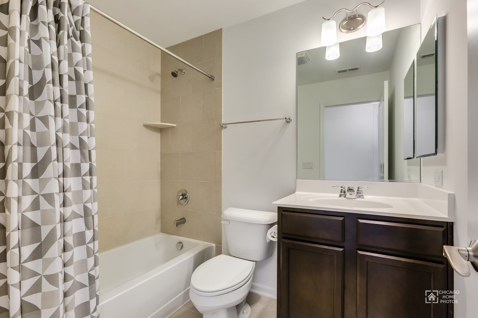 1206 Elm Street Park Ridge, IL 60068 - Photo 16 of 26 a bathroom with a sink toilet vanity and shower