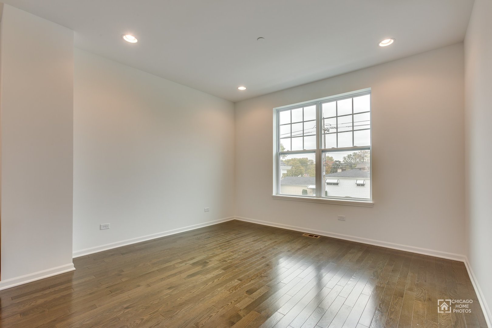 1206 Elm Street Park Ridge, IL 60068 - Photo 21 of 26 an empty room with wooden floor and windows