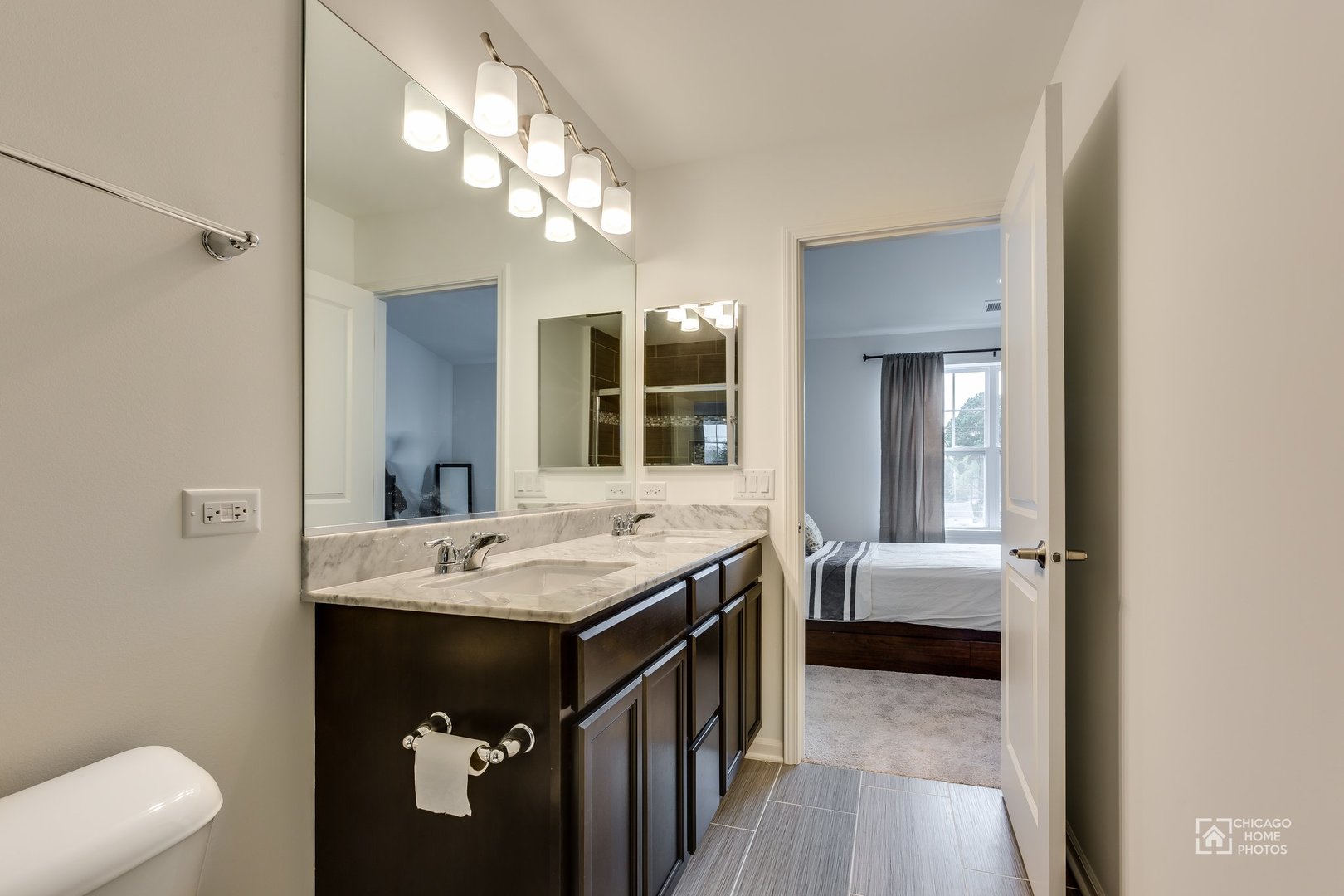 1206 Elm Street Park Ridge, IL 60068 - Photo 7 of 26 a bathroom with a sink a toilet and mirror