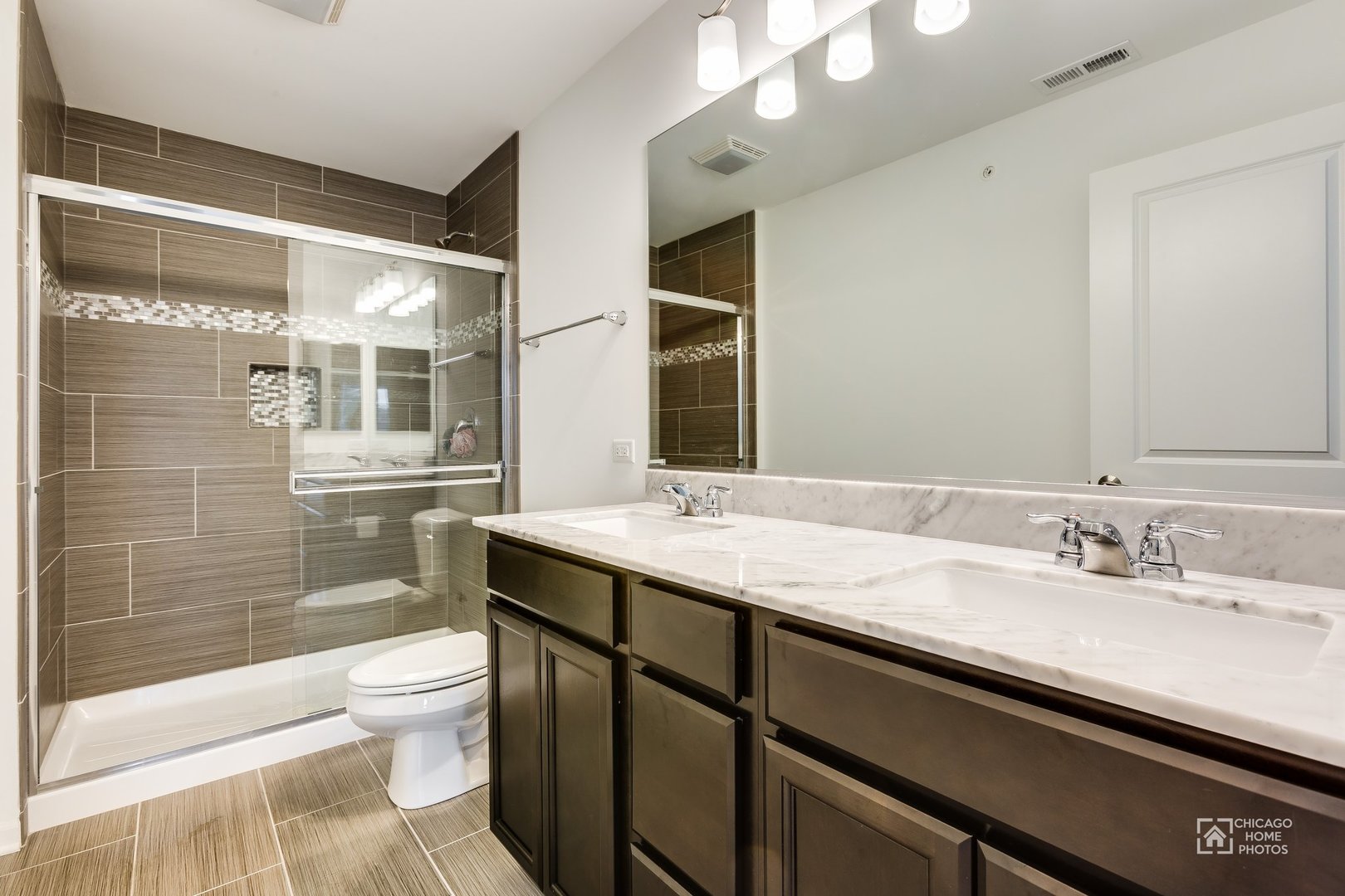1206 Elm Street Park Ridge, IL 60068 - Photo 8 of 26 a bathroom with a granite countertop sink mirror vanity and toilet
