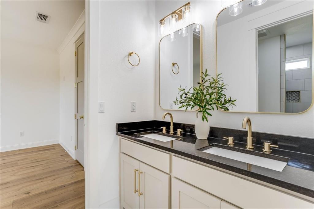 242 Private Road Mount Pleasant, TX 75455 - Photo 33 of 40 Dual vanity with undermount sinks and brass-finish fixtures