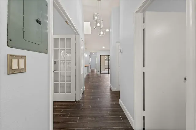 a view of a hallway with washer and dryer