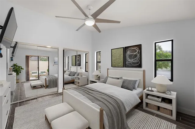 a bedroom with a bed couch and a window