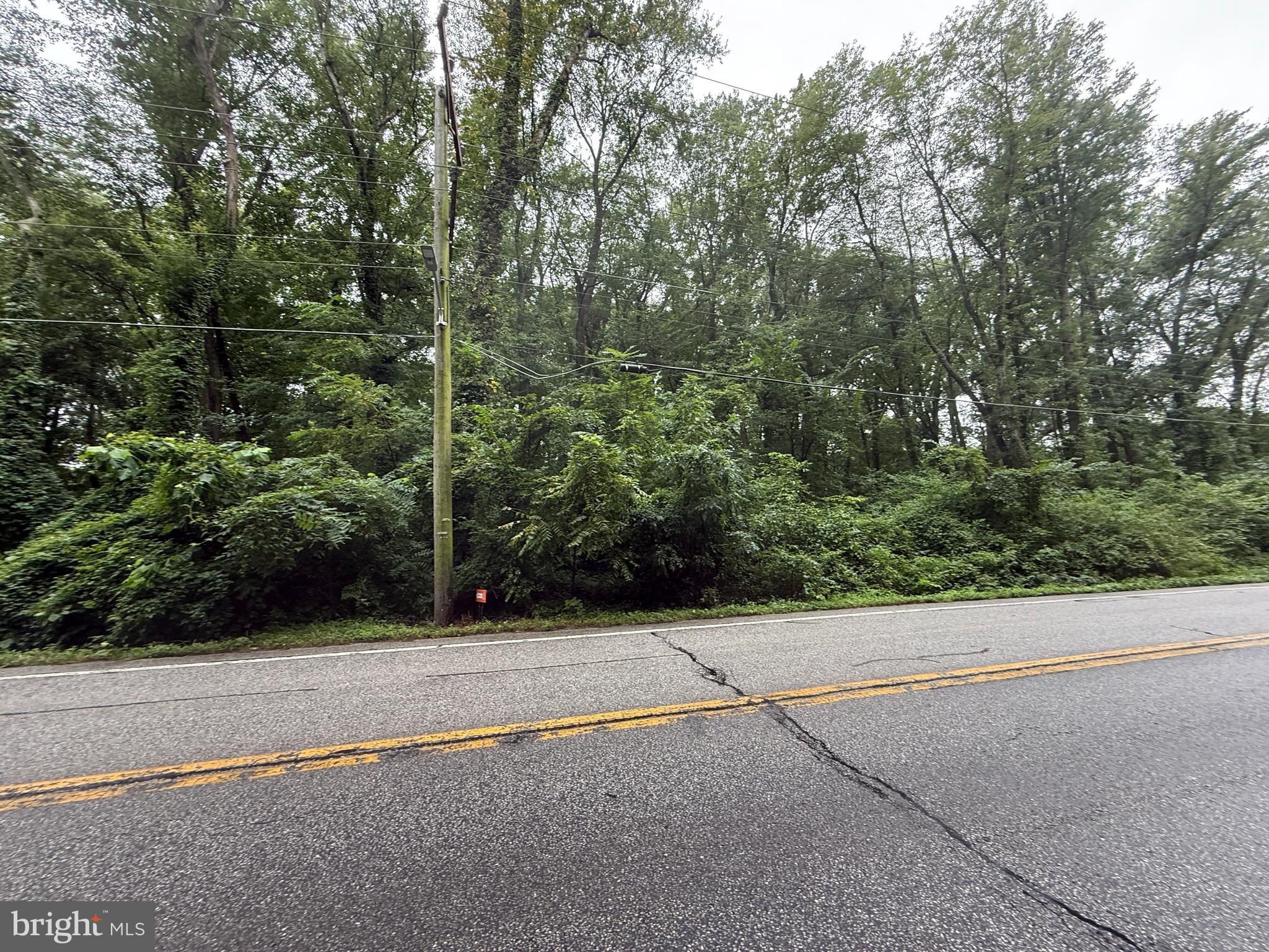 Mayo Road Edgewater, MD 21037 - Photo 5 of 17 a view of a bench in a parking space