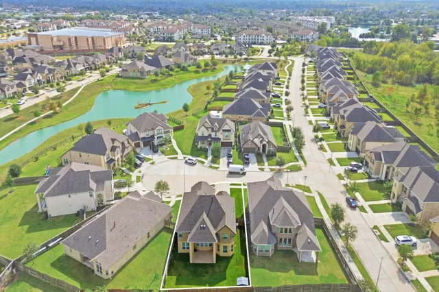 an aerial view of lake residential house with outdoor space